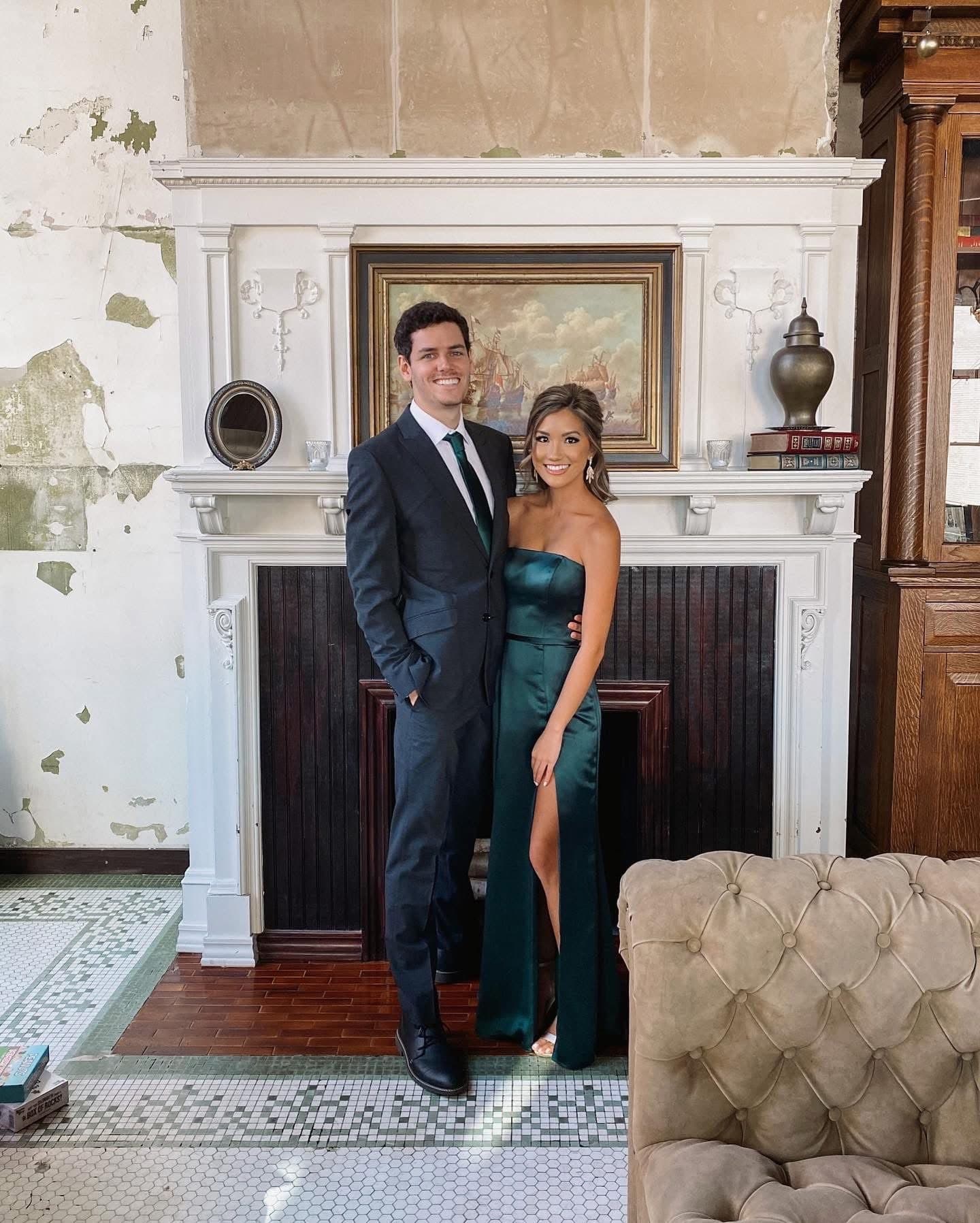 Hayden Harris at a formal event Hayden Harris (@gambitmeta) in a dark suit at a formal event, standing with a companion in a green dress