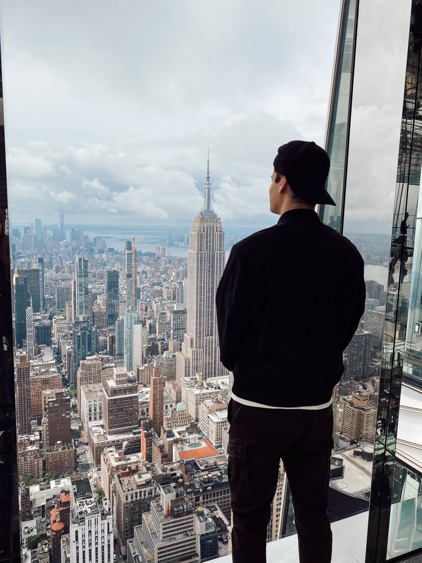 Hayden Harris looking over New York Hayden Harris (@gambitmeta) at a New York observation deck looking toward the Empire State Building