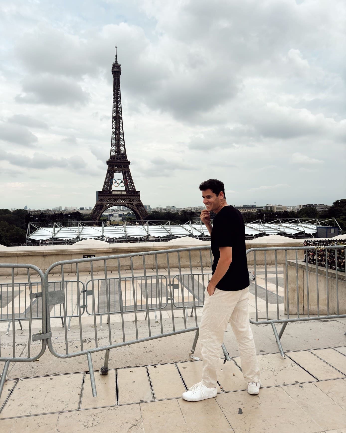 Hayden Harris in Paris Hayden Harris (@gambitmeta) in Paris with the Eiffel Tower and Olympic rings behind him